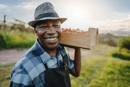 A happy Fruit Picker in the UK with Visa Sponsorship